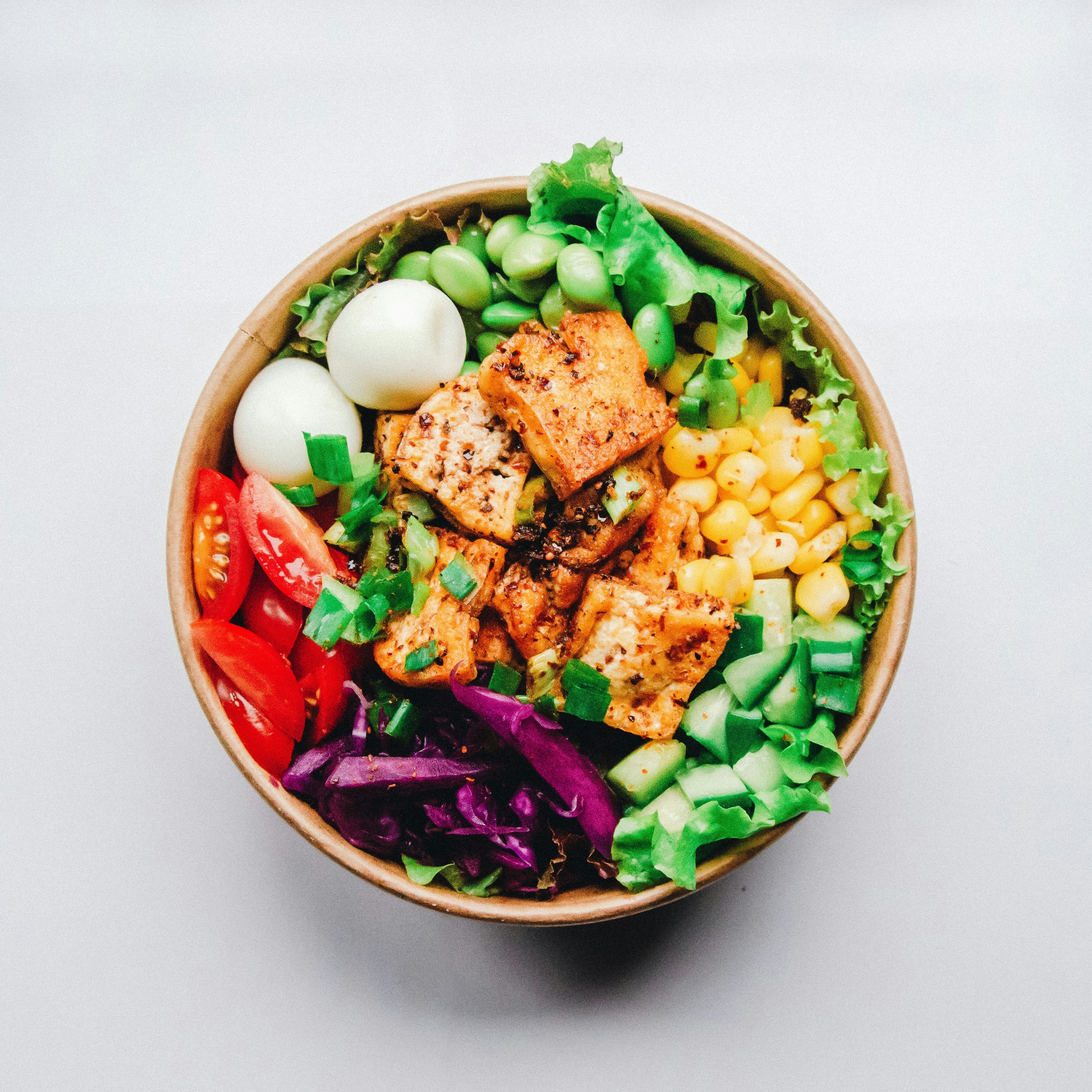 Fresh cooking ingredients laid out on a wooden surface